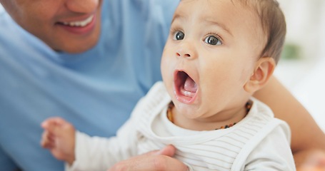 Image showing Father, baby and play in home with toys, care and affection, bonding together and cute. Dad, newborn and kid, infant or toddler relax, enjoying quality family time with parent and love in house.