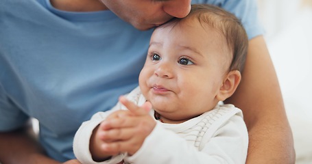 Image showing Father, baby and kiss in home for love, care and affection, bonding together and cute. Dad, newborn and smooch kid, infant or toddler, relax and enjoying quality family time with parent in house.