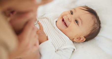 Image showing Baby child, mother and peekaboo on bed with stretching legs, game and funny surprise in family house. Mama, young infant kid and playing together with wow, comic bonding and care with love in nursery