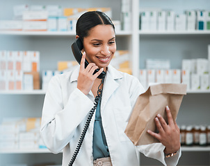 Image showing Phone call, pharmacy and woman with package for medicine, prescription and medication collection. Healthcare, medical care and happy pharmacist speaking for telehealth, consultation and order service