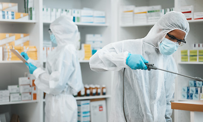 Image showing Pharmacist, team and cleaning inventory with face mask in decontamination or inspection together at drugstore. People, healthcare or medical professional in pharmacy disinfection or bacteria removal