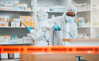 Image showing Biohazard, spray and disinfect with people in a pharmacy for decontamination after a medical accident. Hazmat, chemical or cleaning with healthcare personnel in a drugstore to sanitize and isolate