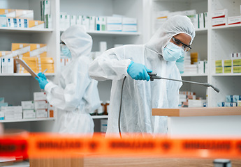 Image showing Hazmat, chemical and disinfect with people in a pharmacy for decontamination after a medical accident. Biohazard, spray or cleaning with healthcare personnel in a drugstore to sanitize and isolate