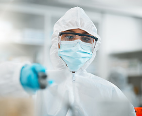 Image showing PPE, disinfection and health, person in face mask and hygiene, cleaning and safety from bacteria and virus. Covid, compliance and healthcare, pharmacy and sanitize with cleaner and chemicals