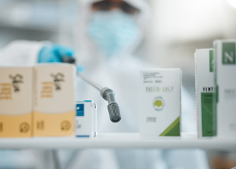 Image showing Box of pills, disinfection and pharmacy, hygiene with person cleaning and safety from bacteria and virus. Covid, compliance and healthcare, spray and sanitizer with cleaner and chemicals in drugstore