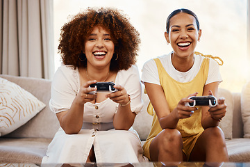 Image showing Women on sofa playing video game, excited fun and relax in home living room together on internet with controller. Online gaming, esports and happy gamer friends on couch with virtual app in apartment