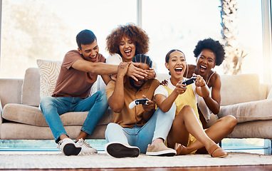 Image showing Group of friends on sofa playing video game, fun and relax in home living room together with internet controller. Online gaming, virtual esports app and couch happy gamer men and women in apartment.