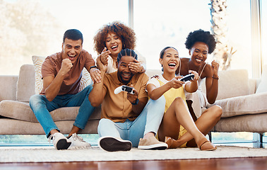 Image showing Group of friends on sofa, celebration and video game, fun and relax in home living room together with internet controller. Online gaming, esports app and couch happy gamer men and women in apartment.