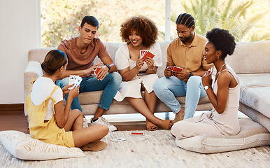 Image showing Game, smile or friends playing cards, poker or black jack at home for gambling together in a holiday party. Happy, men or group of women laughing to relax in living room in a fun match competition