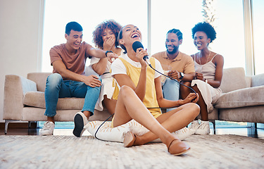 Image showing Microphone, relax or friends singing in home living room together in a party on holiday vacation break. Girl singer, happy men or group of funny women laughing in a fun karaoke competition or game