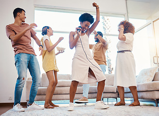 Image showing Happy, party and people singing karaoke in the living room with a microphone to music, playlist or radio. Entertainment, diversity and young friends dancing, bonding and having fun together at home.