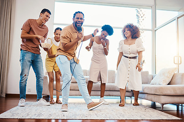 Image showing Energy, entertainment and friends singing karaoke in the living room with a microphone to music, playlist or radio. Happy, diversity and young people dancing, bonding and having fun together at home.