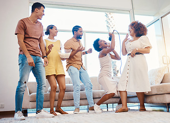 Image showing Karaoke, entertainment and friends singing in the living room with a microphone to music, playlist or radio. Happy, diversity and young people dancing, bonding and having fun together at an apartment