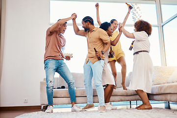 Image showing Beer, excited and friends celebrate at a house with happiness, fun and energy in a lounge. Diversity, alcohol and party with men and women together for drinks, social gathering or reunion at home