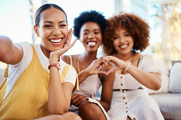 Image showing Portrait, heart hands and selfie of friends in home living room, bonding and having fun on sofa. Face, profile picture and love sign of group of women in photography, happy memory and emoji for care