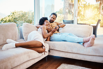 Image showing Happy, relax and a black couple on the sofa, watching tv and talking in a house. Smile, love and an African man and woman with care, speaking and conversation on the living room couch for a movie