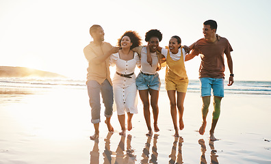 Image showing Summer, freedom and travel with friends at beach for relax, support and sunset. Wellness, energy and happy with group of people walking by the sea for peace, adventure and Hawaii vacation together
