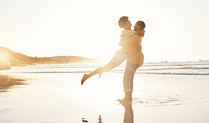 Image showing Beach, sunset and happy couple hug, love enjoy quality time together on South Africa vacation, travel or romantic date. Marriage partner, happiness and excited people embrace on anniversary holiday