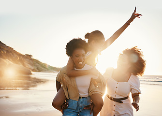 Image showing Beach sunset, laughing women or friends piggyback ride, happiness and fun travel holiday, adventure and summer trip. Nature, freedom or young students smile for sunshine, world tour or social reunion