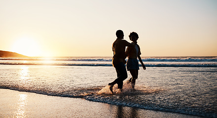 Image showing Beach sunset, sea water and silhouette couple walking, connect or enjoy romantic holiday in South Africa. Love, ocean waves and dark shadow of summer people bond, talking and relax on evening journey