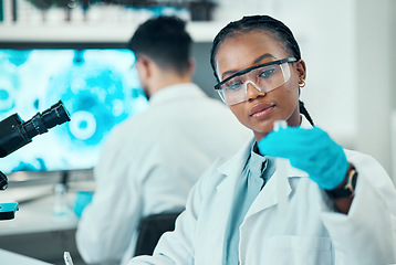 Image showing Science, research and black woman with test tube in laboratory, medical engineering and vaccine technology. Biotechnology, pharmaceutical study and medicine, scientist or lab technician with solution