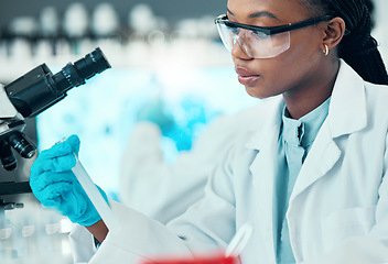 Image showing Science, thinking and black woman with test tube in laboratory, medical engineering and vaccine research. Biotechnology, pharmaceutical study and medicine, scientist or lab technician with solution.