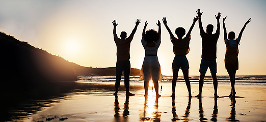 Image showing Beach, celebration and back of friends at sunset with arms up for freedom, fun and travel success. Ocean, silhouette and rear view of people celebrating journey, adventure and summer vacation in Bali