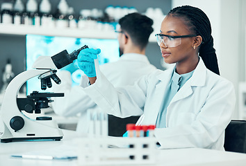 Image showing Scientist, woman and microscope or blood test, research and bacteria, virus or vaccine solution in medical study. Professional doctor or science student with glass tube, biotechnology and laboratory