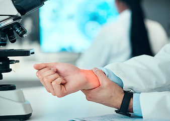 Image showing Joint pain, hands or man scientist with wrist injury, bad problem or carpal tunnel in medical laboratory. Broken bone, arm or overworked doctor feeling bruise muscle or fracture in accident closeup