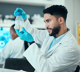 Image showing Science, research and man with solution in bottle in laboratory, results and medical engineering with water sample. Biotechnology, botany study and nature, scientist or lab technician checking glass.