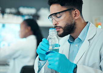 Image showing Science, smell and research with man in laboratory for liquid analysis. medical and pharmacy. Medicine, healthcare and results with scientist and beaker for virus vaccine, test and chemical exam