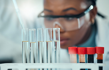Image showing Science, blurred background and blood, woman with test tube in laboratory for research and medical engineering. Biotechnology, pharmaceutical study and pathology, scientist or technician with pipette
