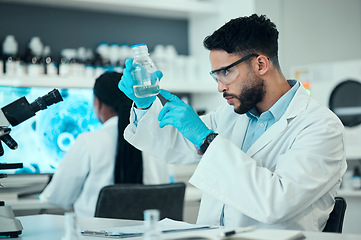 Image showing Science, safety and research, man with glass in lab and medical engineering with pharmaceutical solution. Biotechnology, vaccine study and liquid, scientist or laboratory technician checking bottle.