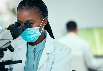 Image showing Microscope, science and female scientist with a face mask in a medical pharmaceutical lab. Professional, scientific and African woman researcher working on virus research with biotechnology equipment