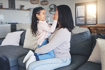 Image showing Touch, happy and playful with mother and daughter on sofa for love, care and support. Funny, calm and relax with woman and young girl embrace in living room of family home for peace, cute and bonding