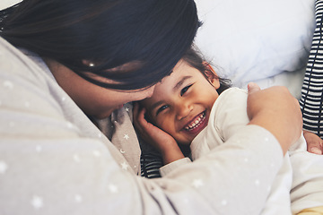 Image showing Bed, mother and daughter hug at home with love, care and happiness in morning. Portrait of a woman and girl child together in a bedroom for fun time, playing and security or relax in a family house