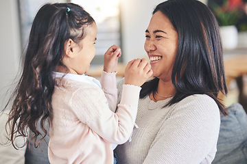 Image showing Funny, happy and playful with mother and daughter on sofa for love, care and support. Smile, calm and relax with woman and young girl embrace in living room of family home for peace, cute and bonding