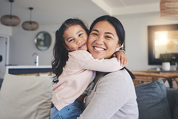 Image showing Hug, happy and portrait of mother and daughter on sofa for love, care and support. Smile, calm and relax with woman and young girl embrace in living room of family home for peace, cute and bonding