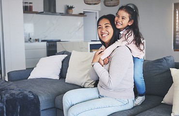 Image showing Hug, happy and love with mother and daughter on sofa for playful, care and support. Smile, calm and relax with woman and young girl embrace in living room of family home for peace, cute and bonding