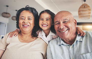 Image showing Smile, relax and portrait of grandparents and child on sofa for happy, bonding and support. Hug, happiness and love with Mexico family and embrace in living room at home for calm, cheerful and peace