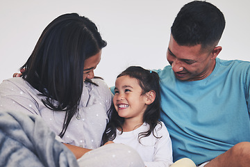 Image showing Love, family and child in bed at home with care, support and happiness in morning. A woman, man and girl kid laugh together in a bedroom for fun time, playing and security or relax in a house