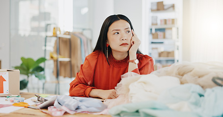 Image showing Woman or fashion designer thinking of ideas in manufacturing studio, inspiration or planning clothes production. Asian person contemplating creative or thoughtful strategy in textile, tailor business