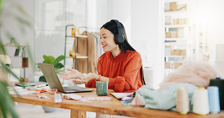 Image showing Video call, laptop and ecommerce with asian woman and talking in warehouse for networking, fashion and design. Online shopping, meeting and conference with girl for clothes, startup and retail