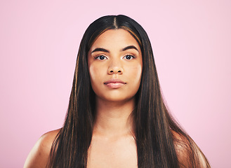 Image showing Portrait, shampoo and hair with a woman on a pink background in studio for keratin treatment. Face, skincare or haircare with a confident young model at the salon for natural beauty or cosmetics