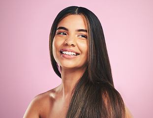 Image showing Smile, hair care and woman with texture, growth and wellness on a pink studio background. Luxury, happy person and female with volume, aesthetic and dermatology with makeup, skincare and healthy skin