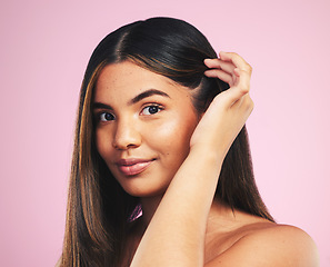 Image showing Portrait, hair care and woman with growth, smile and texture on a pink studio background. Face, person or model with skincare, cosmetics and dermatology with self care, salon treatment and luxury