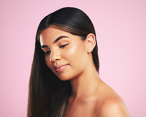 Image showing Thinking, hair care and woman with cosmetics, growth and dermatology on a pink studio background. Ideas, person and female with volume, aesthetic or luxury with makeup, natural beauty or healthy skin