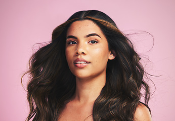 Image showing Portrait, hair care and woman with beauty, wind and texture on a pink studio background. Face, person or model with skincare, cosmetics or dermatology with self care, volume and aesthetic with growth