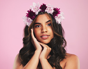 Image showing Woman, portrait and flower crown for beauty in studio with natural skincare, spring plants and pink background. Face, model and floral wreath for sustainable cosmetics, vegan dermatology or hair care