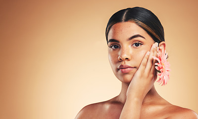 Image showing Skincare, portrait and woman with flower in studio for beauty, wellness and organic cosmetics on brown background. Floral, dermatology and face of female model with plant for care on mockup space